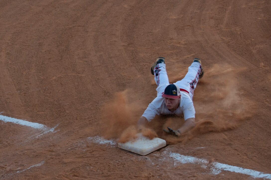 Matthew Stiltner, Langley All-Stars Infielder, slides into third base during the Joint Base Langley-Eustis All-Stars Softball game at Langley Air Force Base, Va., Oct. 14, 2015. The Commander’s Cup is an ongoing competition between U.S. Service members from Fort Eustis and Langley Air Force Base which aims to enhance camaraderie across JBLE through athletic competition. (U.S. Air Force photo by Senior Airman R. Alex Durbin/Released)