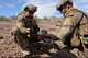 Staff Sgt. Michael Garrison and Staff Sgt. Ryan Stanley, 56th CES team leaders, prepare C4 explosives to destroy an IED. (U.S. Air Force photo by Airman 1st Class Ridge Shan)