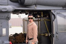 Senior Airman Jacob Ricker, 718th Aircraft Maintenance Squadron crew chief, pauses while preparing an HH-60 Pavehawk for flight Oct. 16, 2015, at Osan Air Base, Republic of Korea. The HH-60 Pavehawk from Kadena Air Base, Japan, and its crew are participating in Exercise Pacific Thunder 15-02. (U.S. Air Force photo by Staff Sgt. Benjamin Sutton) 