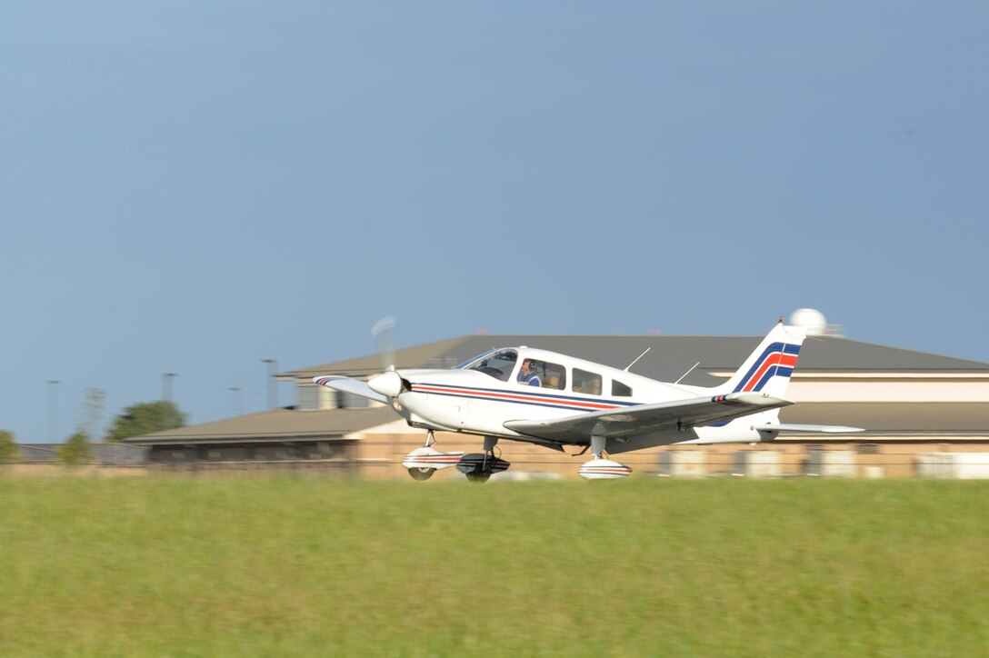 An aircraft touches down on the runway Oct. 17, 2015 at McConnell Air Force Base, Kan. Approximately 100 members of the local flying community visited the base to learn about flight safety as part of a Midair Collision Avoidance Event. (U.S. Air Force photo by Airman 1st Class Tara Fadenrecht)