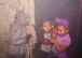 Alyssa Richmond and Ariana Spiller are scared by Staff Sgt. Kristal Deschaines, 436th Civil Engineer Squadron heating, ventilation, and air conditioning technician, Oct. 15, 2015, at the Youth Center on Dover Air Force Base, Del. The haunted house was a part of the fall Deployed Families Dinner. (U.S. Air Force photo/Staff Sgt. Jared Duhon)