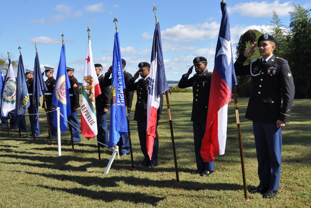 U.S. Army Soldiers from the 7th Transportation Brigade (Expeditionary) participate in a patriotic flag ceremony during Yorktown Day in Yorktown, Va., Oct. 19, 2015. U.S. Marines, Air Force Airmen and Coast Guardsmen also participated in the event by carrying the flags of the 50 U.S. States, the District of Columbia and five U.S. territories. (U.S. Air Force photo by Master Sgt. April Wickes/Released)