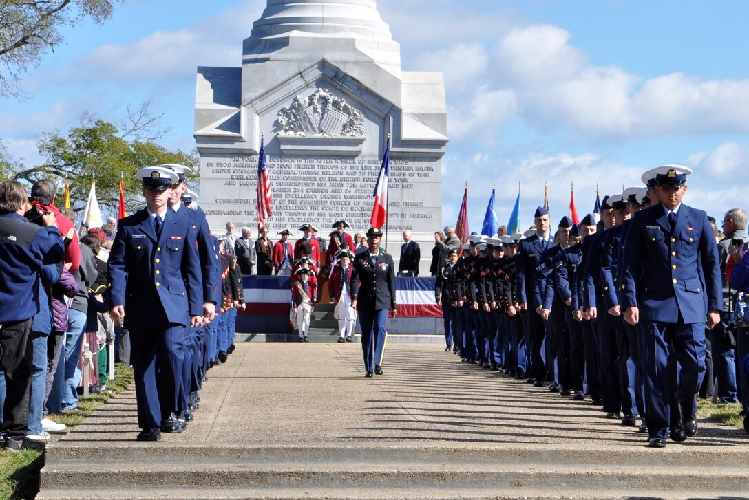 U.S. Army Soldiers and Air Force Airmen from Joint Base Langley-Eustis, Va., participate in a patriotic exercise along with U.S. Marines and Coast Guardsmen during Yorktown Day, Oct. 19, 2015.  Yorktown Day celebrates Battle of Yorktown, the last major land battle of the American Revolutionary War, which ended with British General Lord Charles Cornwallis’ surrender to American and French forces led by General George Washington and Jean-Baptiste Donatien de Vimeur, the Comte de Rochambeau. (U.S. Air Force photo by Master Sgt. April Wickes/Released)