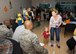 Shelley Saffran and her son, Steven, walk passed the judges of a best costume contest during the Deployed Families Dinner Oct. 15, 2015 at the Youth Center on Dover Air Force Base, Del. The contest was judged by three first sergeants. (U.S. Air Force photo/Staff Sgt. Jared Duhon) 