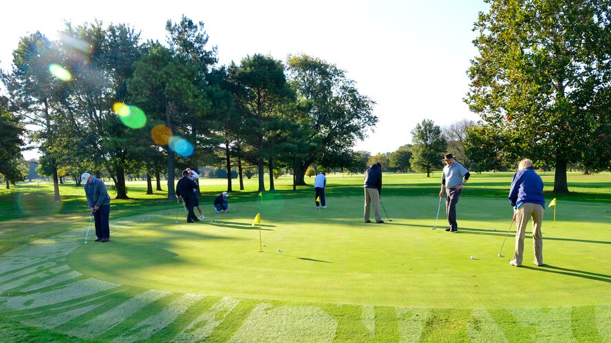 Players practice putting prior to the start of the 2015 Bluesuiters Golf Tournament Oct. 16, 2015, at Eagle Creek Golf Course on Dover Air Force Base, Del. The tournament is a semi-annual event that pairs local civic and business leaders with Team Dover Airmen. (U.S. Air Force photo/Senior Airman William Johnson)