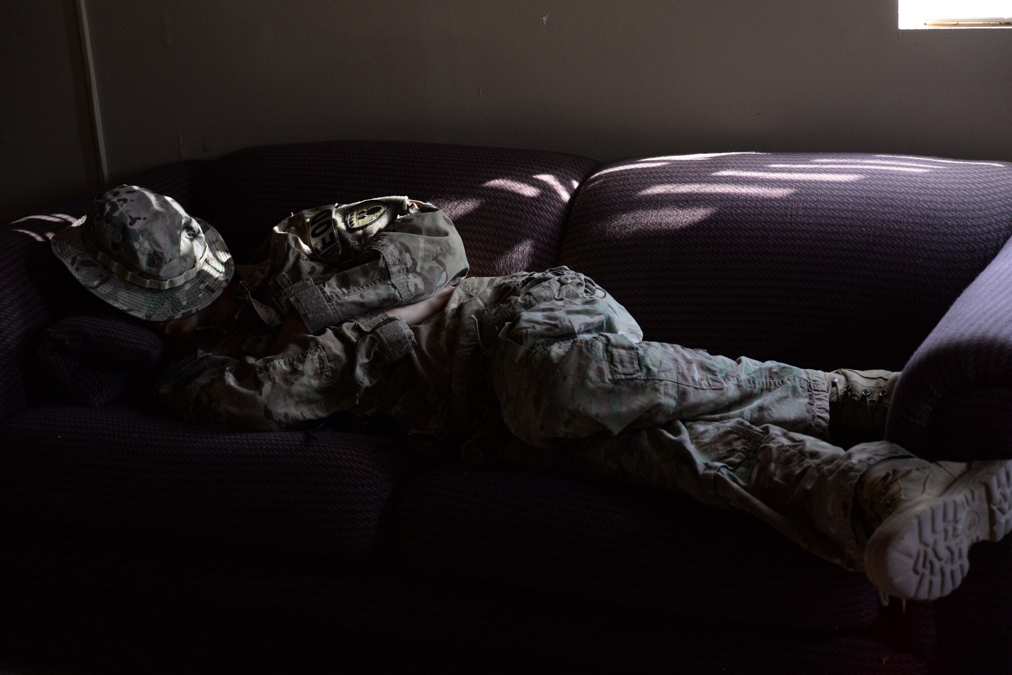 Staff Sgt. Michael Harvaki, 56th CES EOD team leader, naps during a break in training Sept. 3 at Gila Bend. Operation Enduring Training 2015 pits EOD Airmen against realistic and grueling challenges which simulate the hostile environment they may encounter in deployed combat zones. (U.S. Air Force photo by Airman 1st Class Ridge Shan)