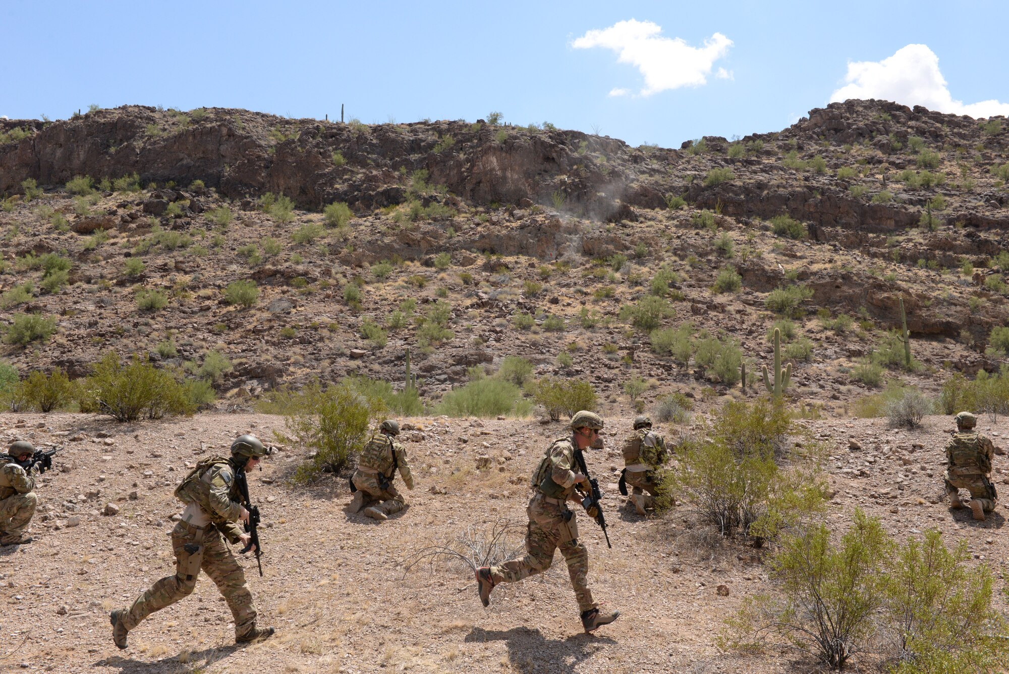 EOD Airmen engage in small-unit tactics and live-fire training at the range. Operation Enduring Training 2015 teaches and maintains combat-ready skills to Airmen based at Luke and other nearby installations. (U.S. Air Force photo by Airman 1st Class Ridge Shan)