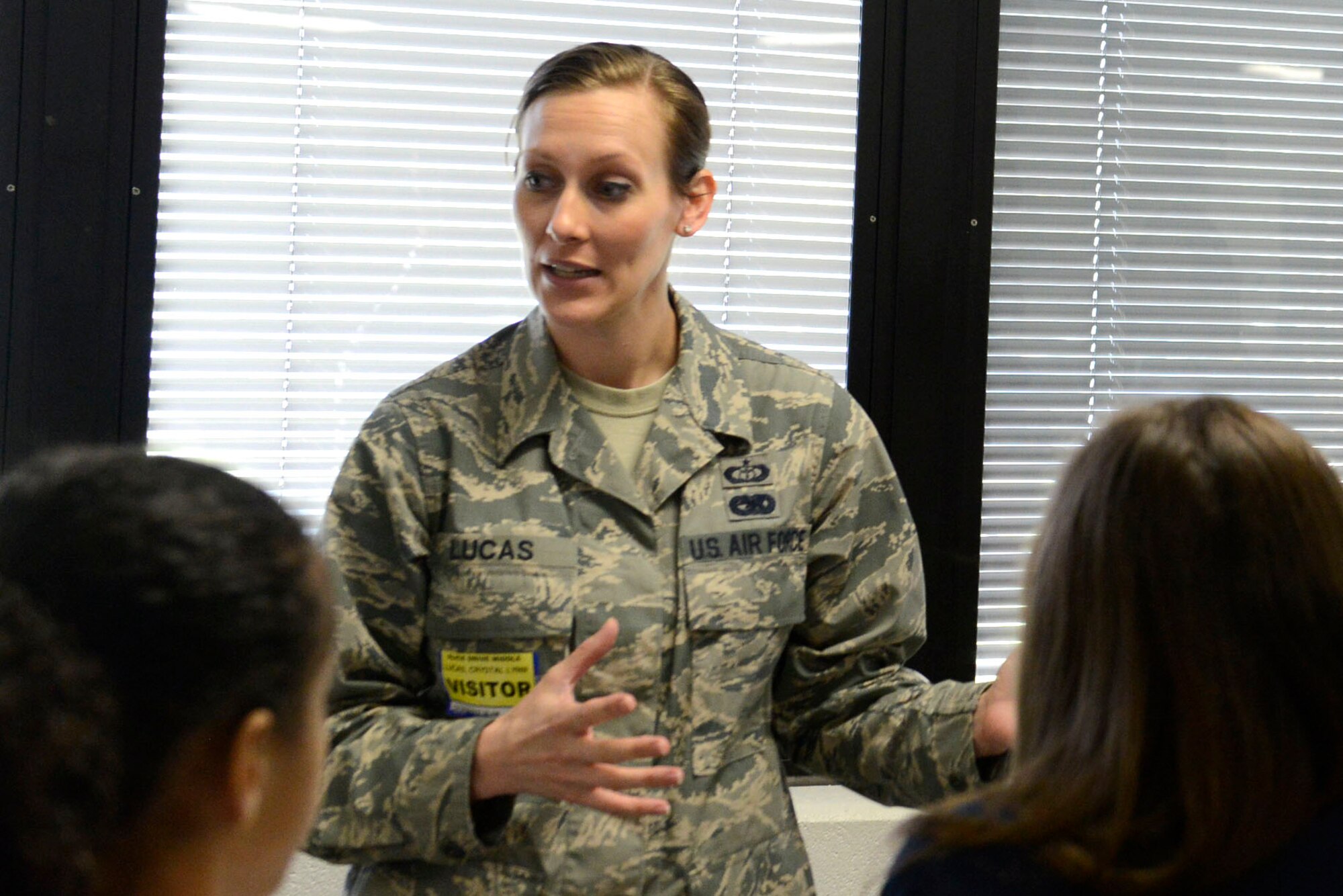 U.S. Air Force Tech. Sgt. Crystal Lucas, 20th Operation Support Squadron weather forecaster, speaks to middle school students about weather at Alice Drive Middle School, Sumter, S.C., Oct. 15, 2015. Lucas taught the students about a weather kestrel, a tactical hand device that 20th OSS weather flight Airmen use to obtain weather data such as dew point, wind speed, and temperature. (U.S. Air Force photo by Airman 1st Class Christopher Maldonado/Released)