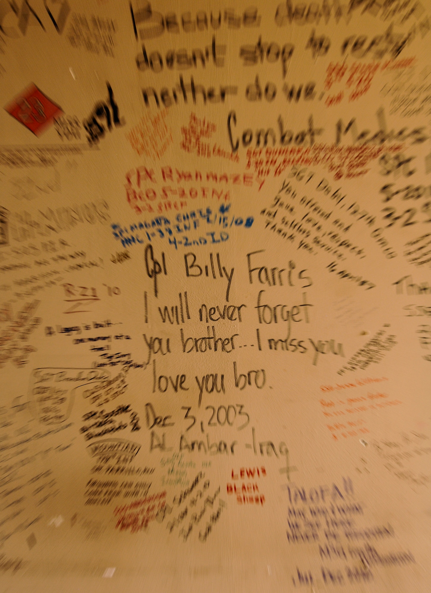 A dedication to U.S. Army Cpl. Billy Farris is displayed alongside signatures and dedications on the Walls of Balad at the 309th Aerospace Maintenance and Regeneration Group, Davis-Monthan Air Force Base, Ariz., Oct. 16, 2015. Farris, 20, of Bapchule, Ariz., died Dec. 3, 2003, in Taji, Iraq, from injuries suffered when an improvised explosive device detonated near his vehicle while conducting escort operations. Farris was assigned to the 5th Battalion, 20th Infantry Regiment, 3rd Brigade, 2nd Infantry Division, Fort Lewis, Wash. (U.S. Air Force photo by Staff Sgt. Angela Ruiz/Released)