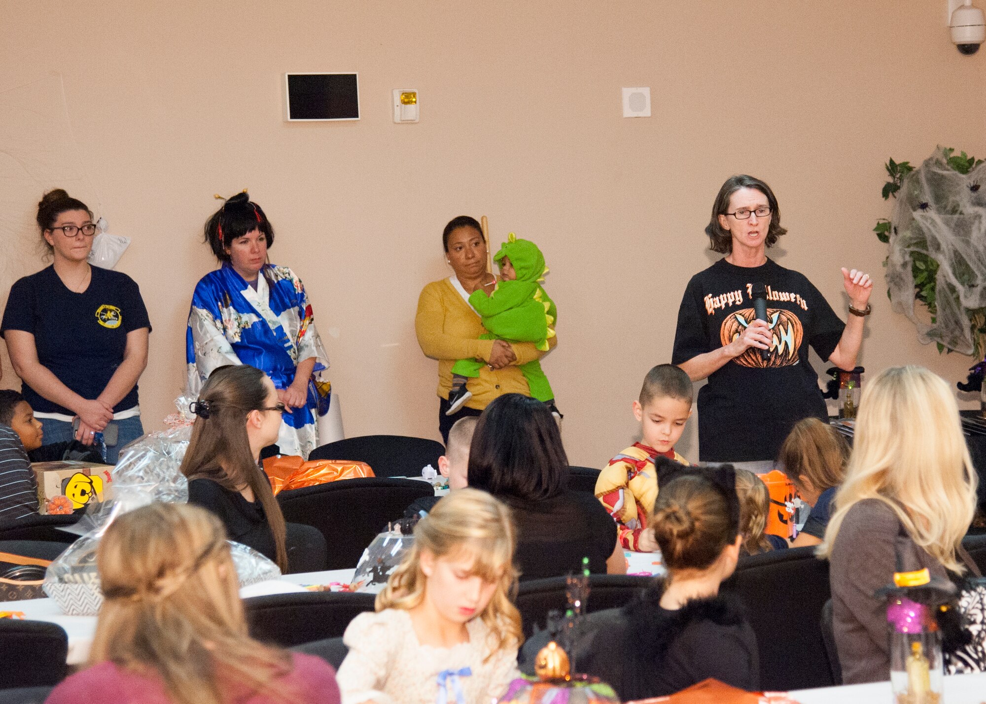 Col. Lisa Pike, 436th Mission Support Group commander, speaks during the start of the Deployed Families Dinner Oct. 15, 2015, at the Youth Center on Dover Air Force Base, Del. Along with the dinner, a haunted house was built outside featuring smoke machines, strobe lights and volunteers dressed in costume to scare people as they walked through. (U.S. Air Force photo/Staff Sgt. Jared Duhon) 