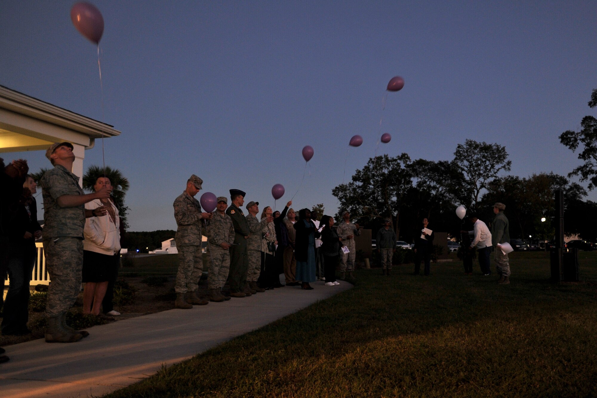 Members of Joint Base Charleston release balloons in remembrance of all of those who have been victims of domestic violence during a ceremony held at the Forest City Community Center, Joint Base Charleston, S.C., Oct. 19, 2015. This annual ceremony helps raise awareness of the cost of domestic violence for those who have lost their lives and those who are survivors. (U.S. Air Force photo/Tech. Sgt. Renae Pittman)