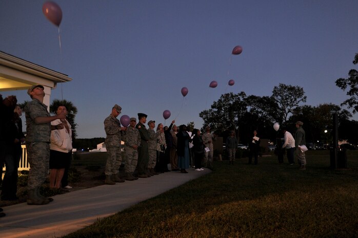 Members of Joint Base Charleston release balloons in remembrance of all of those who have been victims of domestic violence during a ceremony held at the Forest City Community Center, Joint Base Charleston, S.C., Oct. 19, 2015. This annual ceremony helps raise awareness of the cost of domestic violence for those who have lost their lives and those who are survivors. (U.S. Air Force photo/Tech. Sgt. Renae Pittman)