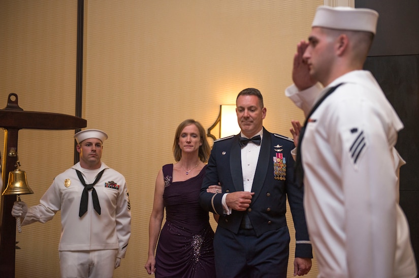 Colonel Robert Lyman, 628th Air Base Wing commander, walks the red carpet with his wife, Nancy, at the start of the Navy Ball at the Charleston Marriott Hotel on Oct. 17, 2015. The Navy Ball was celebrating the Navy’s 240th birthday.