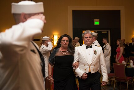 Captain Timothy Sparks, Joint Base Charleston deputy commander, walks the red carpet with his wife, Brenda, at the start of the Navy Ball at the Charleston Marriott Hotel on Oct. 17, 2015. The Navy Ball was celebrating the Navy’s 240th birthday.