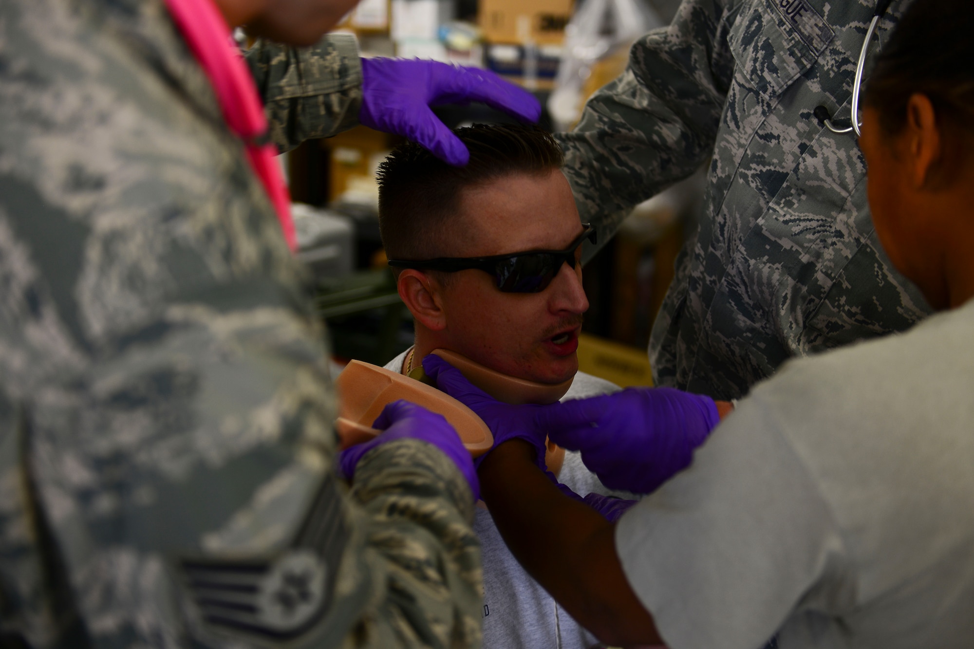 U.S. Air Force Airmen from the 633rd Medical Group attend to a simulated patient during a mass casualty exercise at Langley Air Force Base, Va., Oct. 15, 2015. The Airmen had to ensure simulated patients were treated in a timely manner during the exercise. (U.S. Air Force photo by Staff Sgt. Ciara Gosier/Released)