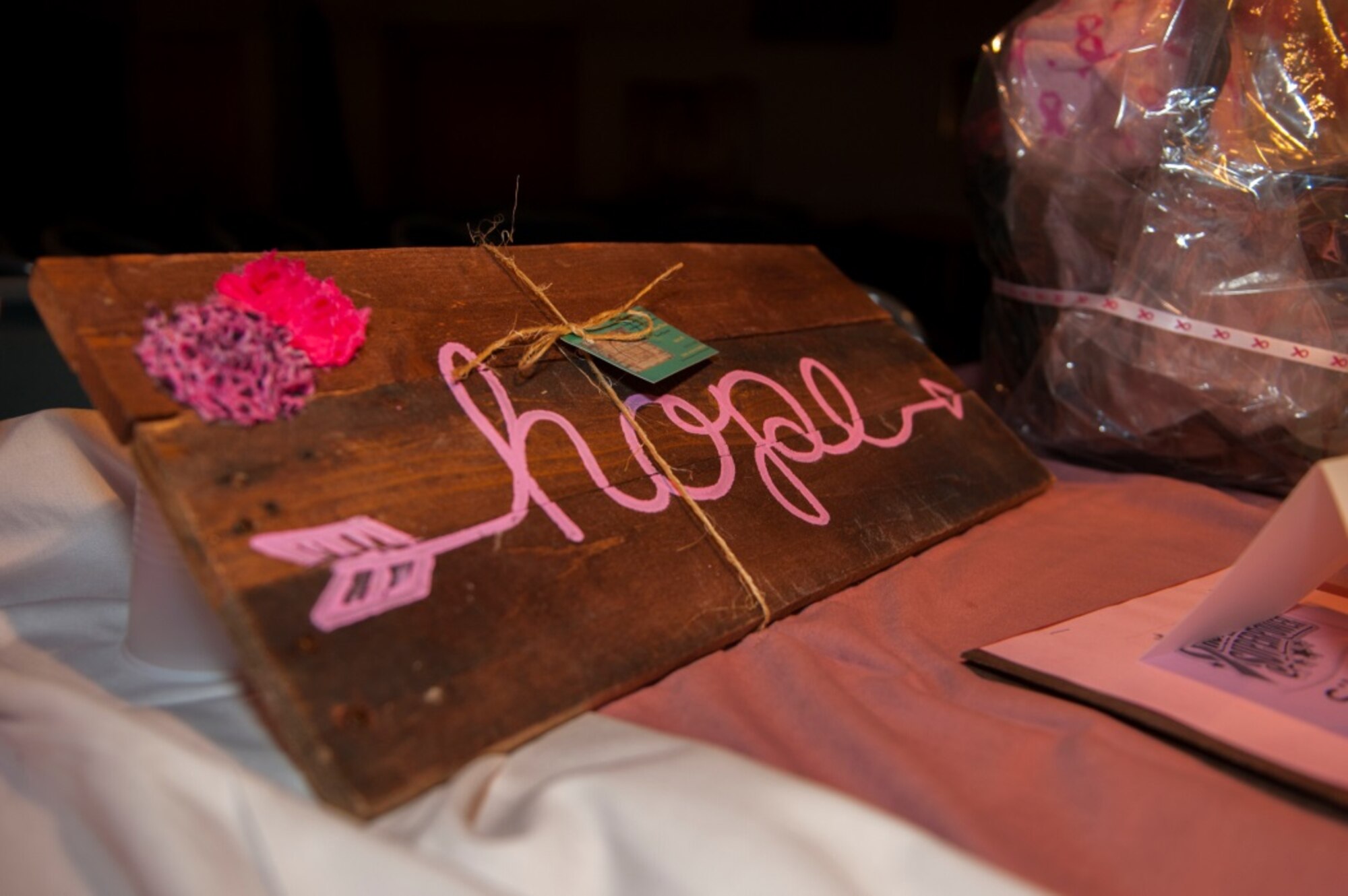 A breast cancer “hope” board set to be auctioned off during the annual breast cancer awareness luncheon at Minot Air Force Base, N.D., Oct. 9, 2015. The luncheon gave away various pink and breast cancer related items in support of breast cancer research funding. (U.S. Air Force photo/Airman 1st Class Christian Sullivan)