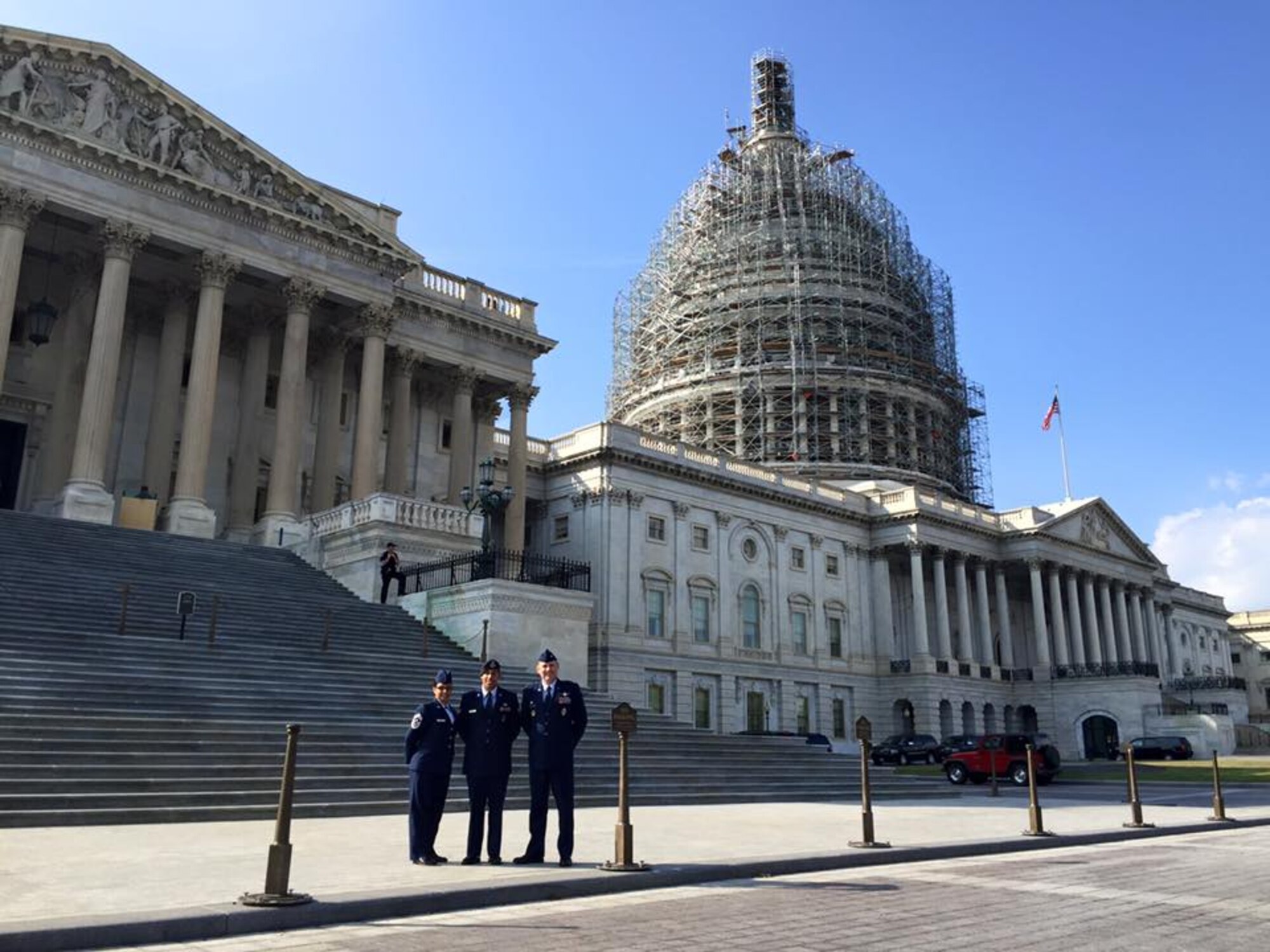 WASHINGTON – (from left) Chief Master Sgt. Idalia Peele, 21st Space Wing command chief, Senior Airman Christian Mejia, 721st Security Forces Squadron, and Col. Doug Schiess, 21st Space Wing commander, stand in front of the U.S. Capitol Building during a recent visit, Oct. 7-8, 2015. The trip to Washington provided wing leadership a chance to meet congressional representatives and senators and discuss the mission of the 21st SW and it’s geographically separated units. Mejia was selected to attend because of his standout performance as a training manager and excelling in the Pre-Ranger assessment course. (courtesy photo)