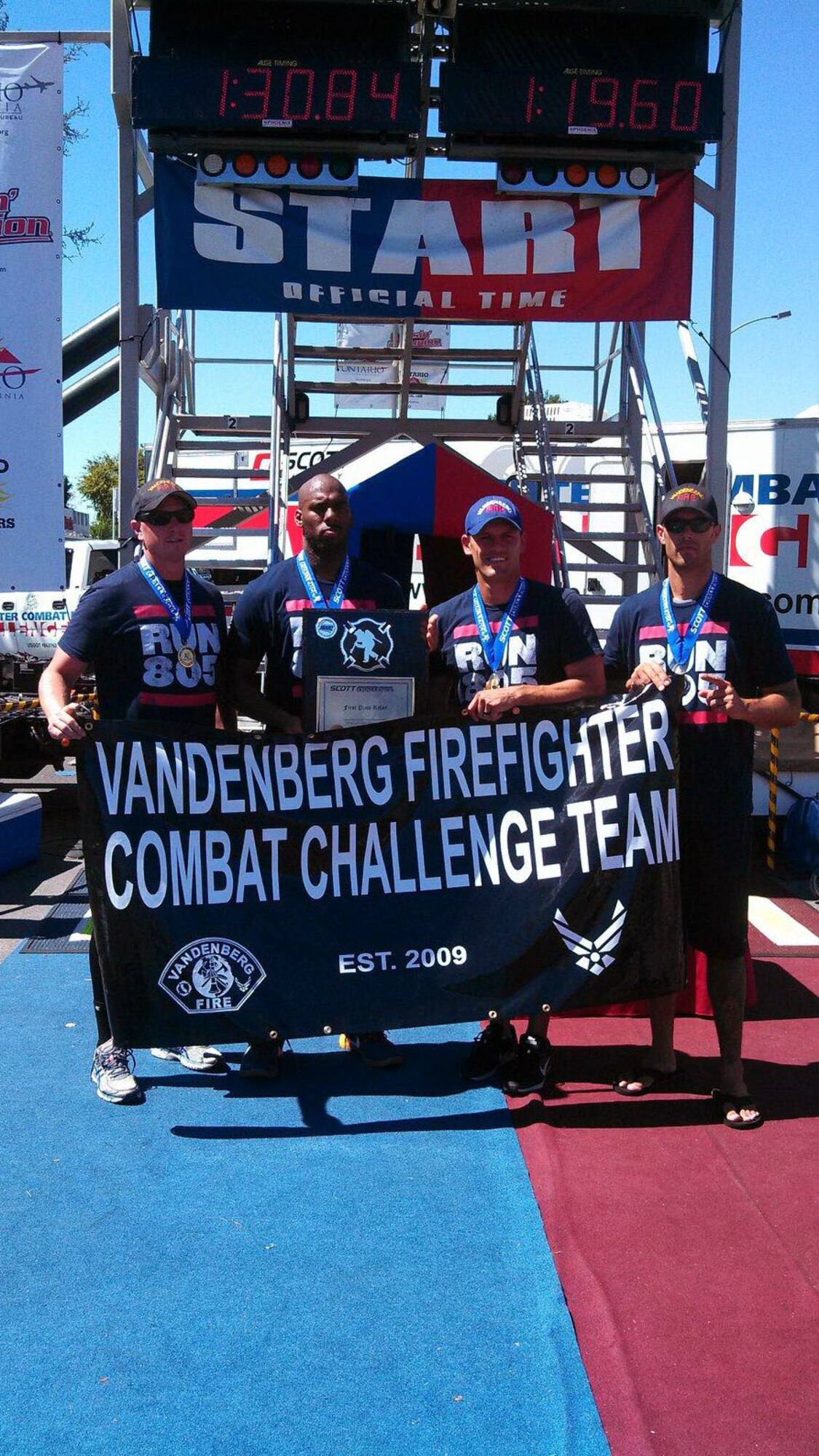 30th Civil Engineer Squadron firefighters, and members of the Vandenberg firefighter combat challenge team, Tech. Sgt. Matthew Lutz, Lamont Brown, Staff Sgt. Glenn Silva and Tech. Sgt. Joseph Absher pose for a photo after winning first place in the relay portion of the 408th Scott Firefighter Combat Challenge, Sept. 20, 2015, Ontario, California. The challenge began as a university-based research study and has since evolved into a five-event obstacle course, simulating the physical rigors of structural firefighting. Following the local competition, the team will move on to compete against crews from all over the globe -- in the world challenge, held in Montgomery, Ala., Oct. 19 through 24. (Courtesy photo)