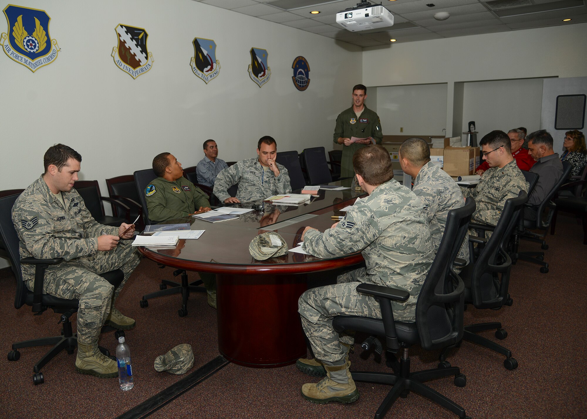 Capt. Bandy Jeffrey (standing), 2015 Combined Federal Campaign installation point of contact, held a training session in Bldg. 3950 Oct. 19 to teach unit representatives how to take donations. (U.S. Air Force photo by Rebecca Amber)