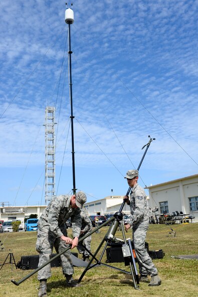 U.S. Air Force Airmen from the 353rd Special Operations Support Squadron Weather Flight, Airman 1st Class Cameron Champ, weather apprentice, and Staff Sgt. Rudi Vogel, NCO in charge of training and contingency operations, set up a tactical observing station Oct. 19, 2015, on Kadena Air Base, Japan. Most tactical weather equipment is designed to be portable and capable of being set up and operated by one or two individuals so weather support can be provided in remote locations throughout the Indo-Asia-Pacific Region. (U.S. Air Force photo by Senior Airman John Linzmeier)