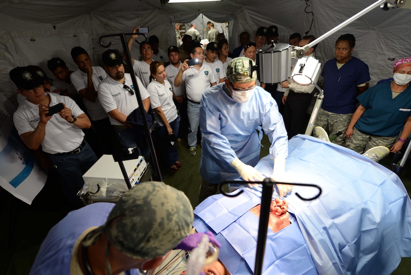 Members from the Honduran Defense College are shown how Mobile Surgical Teams work during a visit to Soto Cano Air Base, Honduras, Oct. 16, 2015. The visit provided a better understanding of JTF-Bravo’s mission and capabilities for the Defense College members. (U.S. Air Force photo by Senior Airman Westin Warburton/Released)