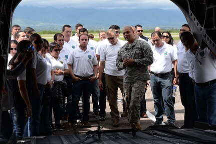 U.S. Army Sgt. Jesse Gomez, 1-228 aviation regiment, explains how the CH-47 Chinook helicopter works for the Honduran Defense College during a visit to Soto Cano Air Base, Honduras, Oct. 16, 2015. The visit provided a better understanding of JTF-Bravo’s mission and capabilities for the Defense College members. (U.S. Air Force photo by Senior Airman Westin Warburton/Released)