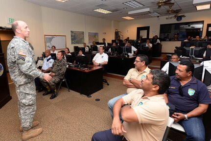 U.S.  Army Col. Robert J. Harman, Joint Task Force-Bravo commander, speaks to members from the Honduran Defense College during a visit to Soto Cano Air Base, Honduras, Oct. 16, 2015. The visit provided a better understanding of JTF-Bravo’s mission and capabilities for the Defense College members. (U.S. Air Force photo by Senior Airman Westin Warburton/Released)
