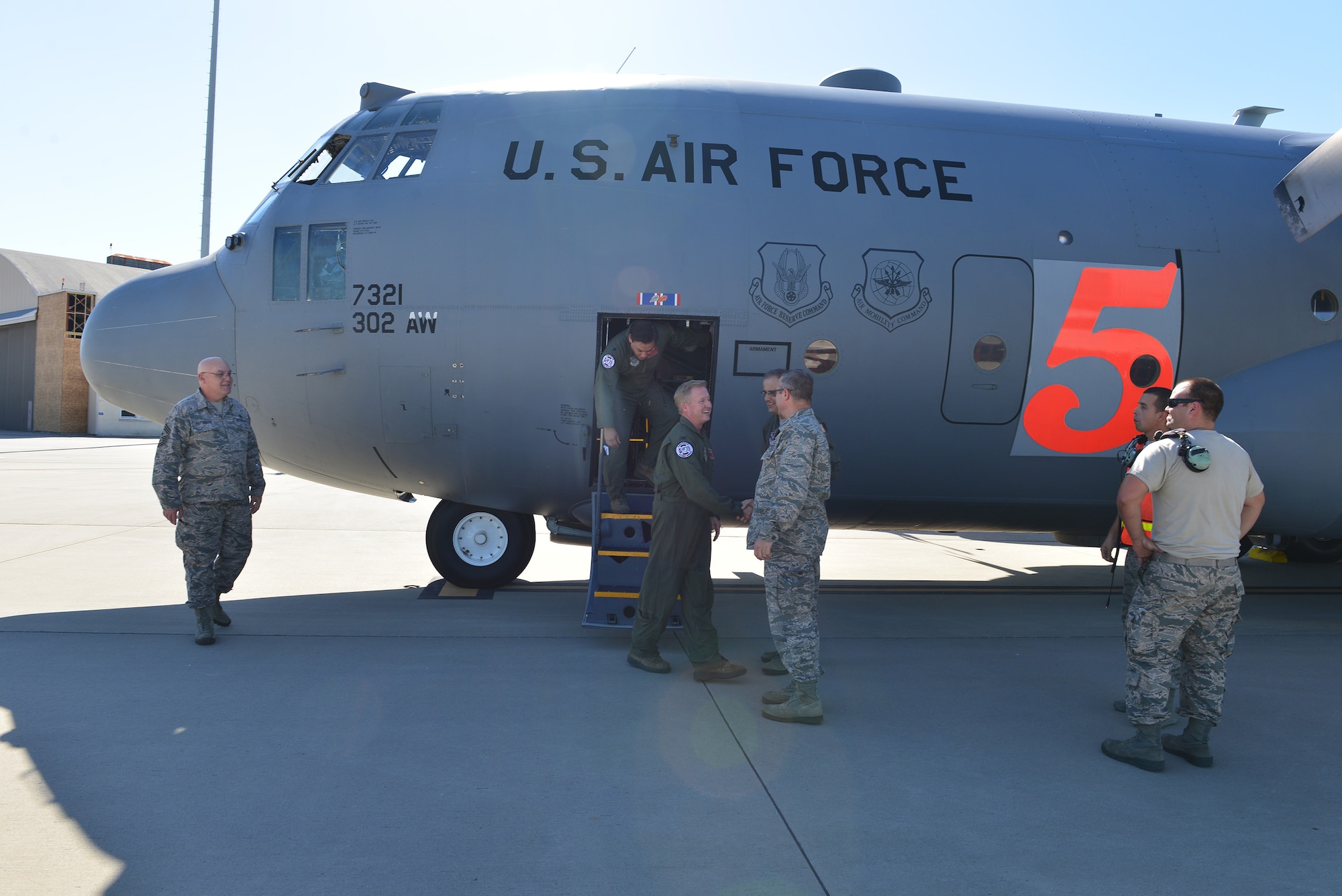 U.S. Air Force Brig. Gen. Jesse Simmons the Air Commander for the Georgia National Guard greets 165th Airlift pilots on the ramp of the 165th AW after landing the C-130H3 Hercules, Oct. 15, 2015.  The 165th Airlift Wing received the first of eight aircraft upgrades expected to take place through 2016. The upgrades will better allow the Georgia Air National Guard unit to support State, Federal, and worldwide contingencies. (Air National Guard photo by Tech. Sgt. Amber Williams/Released)