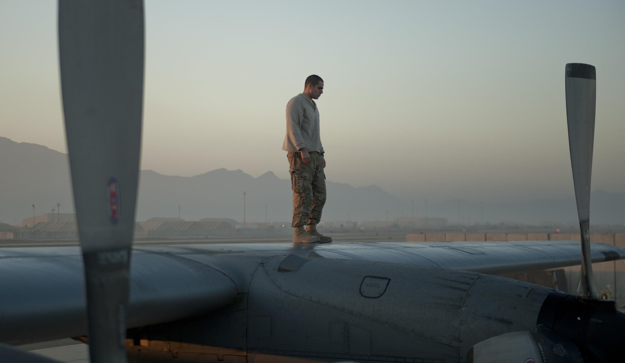 U.S. Air Force Staff Sgt. Adam Luna a 41st Expeditionary Aircraft Maintenance Unit aerial repair technician deployed from the 355th Equipment Maintenance Squadron at Davis-Monthan Air Force Base, Ariz.; conducts a post operations check on a EC-130H Compass Call aircraft following a mission Oct. 20, 2015, Bagram Airfield, Afghanistan.  The Compass Call is an airborne tactical weapon system using a heavily modified version of the C-130 Hercules airframe. (U.S. Air Force photo by Capt. Bryan Bouchard/Released)