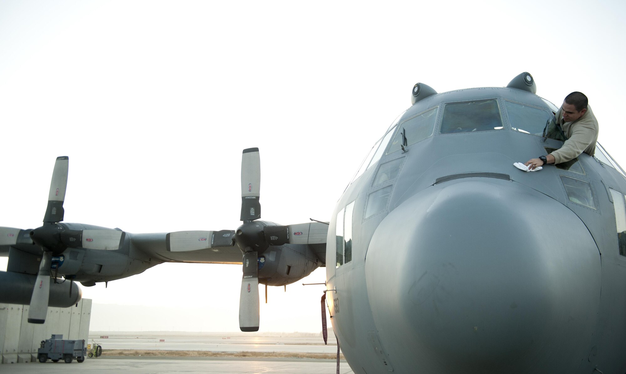 U.S. Air Force Staff Sgt. Adam Luna a 41st Expeditionary Aircraft Maintenance Unit aerial repair technician deployed from the 355th Equipment Maintenance Squadron at Davis-Monthan Air Force Base, Ariz.; conducts a post operations check on a EC-130H Compass Call aircraft following a mission Oct. 20, 2015, Bagram Airfield, Afghanistan.  The Compass Call is an airborne tactical weapon system using a heavily modified version of the C-130 Hercules airframe. (U.S. Air Force photo by Capt. Bryan Bouchard/Released)