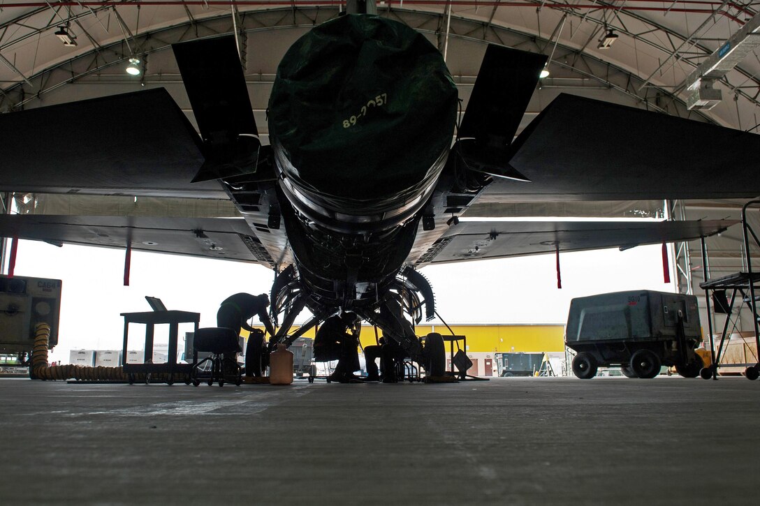 U.S. airmen work to complete a 400-hour phase inspection on an F-16 Fighting Falcon aircraft at Bagram Airfield, Afghanistan, Oct. 18, 2015. The airmen are assigned to the 455th Expeditionary Maintenance Squadron. The 400-hour inspection lasts approximately five days from the time the aircraft is picked up from the flight line to the time it is returned. U.S. Air Force photo by Tech. Sgt. Joseph Swafford
