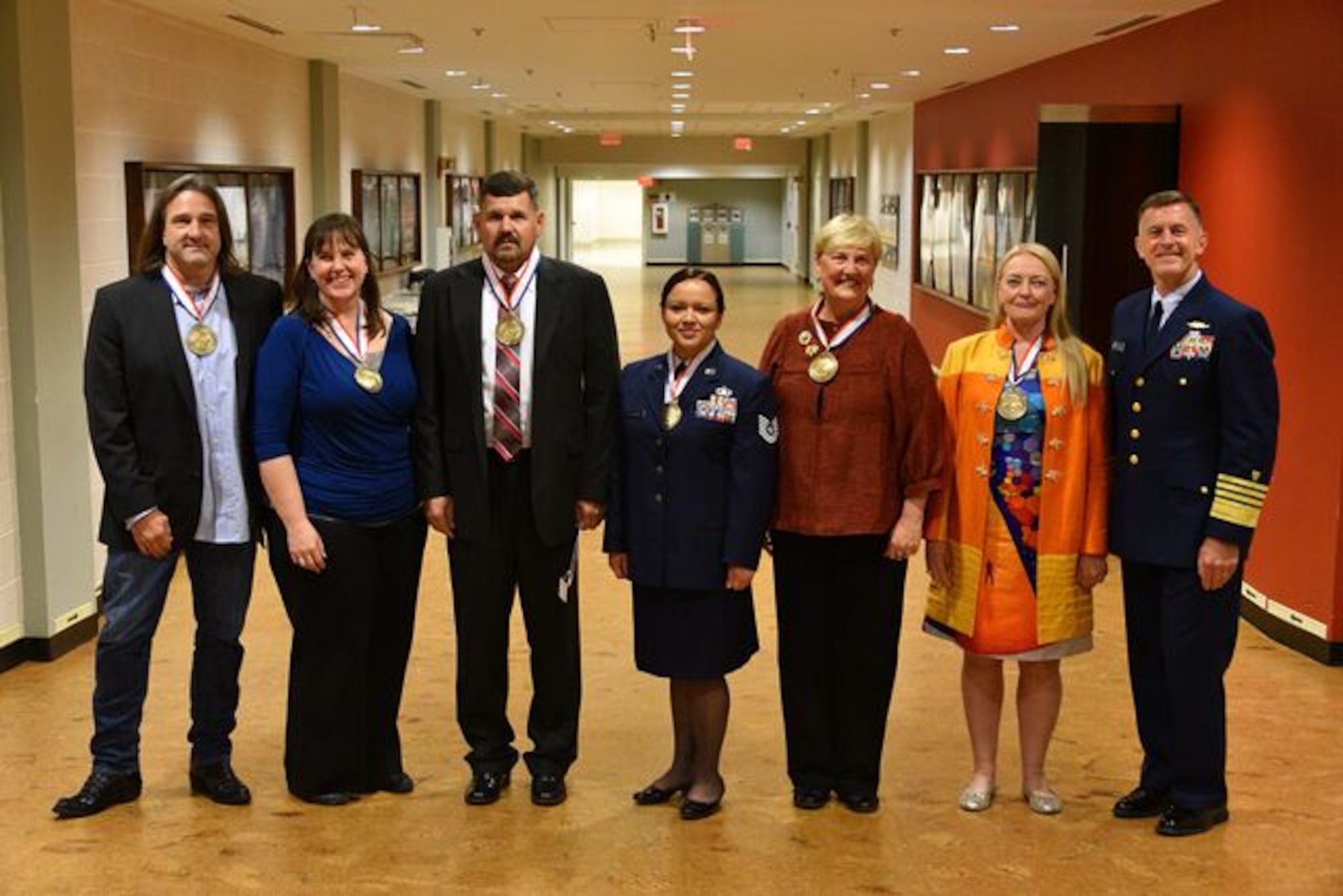 Recipients of the 2015 Department of Defense Spirit of Hope Award pose for a photo with Coast Guard Commandant Adm. Paul F. Zukunft, right, who presided over the award ceremony at the Pentagon Oct. 16, 2015. Left to right, the recipients are a representative who accepted the award for country music star Toby Keith, nominated by the Office of the Secretary of Defense and the Joint Staff; Dana Hinesly, nominated by the Army; a representative of the Quantico Injured Military Sportsmen Association, nominated by the Marine Corps; Tech. Sgt. Rebecca Martin, nominated by the Air Force; Sandra Lehmkuhler, nominated by the Navy; and Suzanne Maas, nominated by the Coast Guard. (U.S. Coast Guard photo/Petty Officer 2nd Class Patrick Kelley)