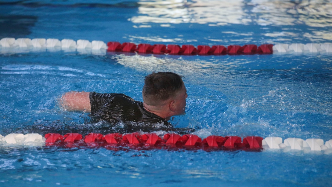 A Marine candidate with the Scout Sniper Screening Platoon, 2nd Battalion, 8th Marine Regiment, conducts a 500-meter swim as part of the Scout Sniper Physical Assessment Test at Camp Lejeune, N.C., Oct. 19, 2015. The 500-meter swim was the first of several physically demanding events that tested endurance, strength and speed. 