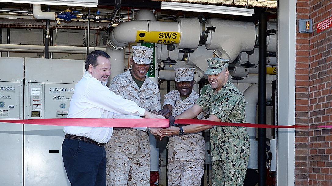 Military and civilian leaders officially mark the start of America’s first Borehole Thermal Energy Storage system - a state-of-the-art ground source heat pump system – with a ribbon-cutting ceremony at Building 3700, here, Oct. 19. From left: Chuck W. Hammock Jr., principal engineer, Andrews, Hammock & Powell, Inc., Macon, Ga.; Maj. Gen. Craig C. Crenshaw, (second from left) commanding general, Marine Corps Logistics Command; Col. James C. Carroll III (third from left), commanding officer, MCLB Albany; and Navy Lt. Jose Centenorosado, director, Facilities, MCLB Albany.