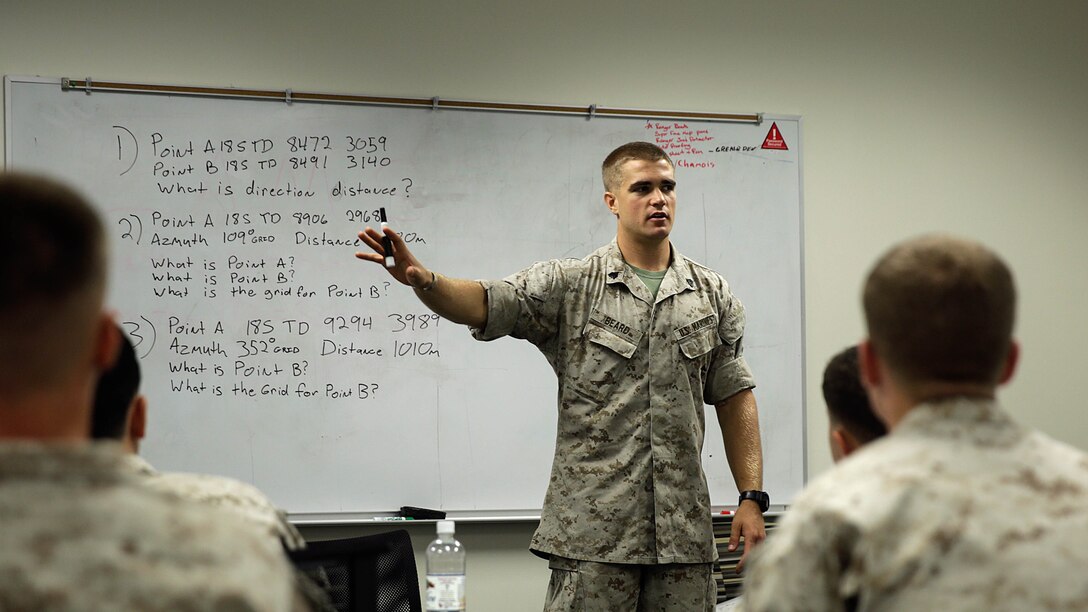 Sgt. Michael Beard, the chief scout sniper with 2nd Battalion, 8th Marine Regiment, instructs how to plot points for an eight-digit grid during a land navigation class in preparation for the scout sniper platoon screener, Oct. 14, 2015, at Camp Lejeune, N.C.  More than 15 Marines with the battalion are taking part in the course to prepare themselves for the scout sniper platoon screener.  