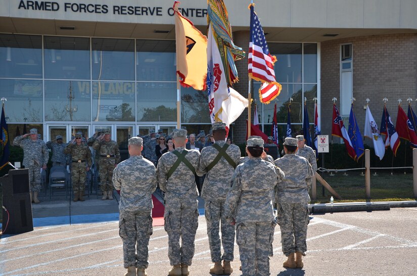Brig. Gen. Steven Eveker, commanding general for the Deployment Support Command of Birmingham, Ala. (far left), Brig. Gen. Jeffrey Doll, incoming commander of the Army Reserve Sustainment Command also of Birmingham, Ala., Maj. Gen. Les Carroll, commanding general of the 377th Theater Sustainment Command, Belle Chasse, La., Soldiers, family, and friends salute the nation’s colors during the playing of the national anthem during the ARSC’s Assumption of Command Ceremony for Doll.