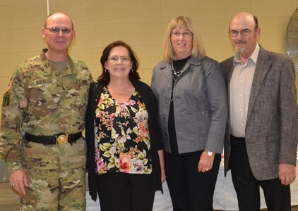 (pictured left to right) Brig. Gen. Jeffrey Doll, incoming commander of the Army Reserve Sustainment Command of Birmingham, Ala. with his wife, Karen Doll, his sister-in-law Cathy Doll, and his brother Pat Doll, both of North Dakota celebrate with Doll during the ARSC’s Assumption of Command Ceremony on Oct. 17.