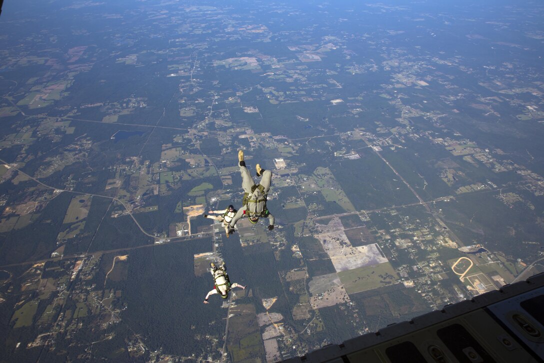 Marines with 3rd Force Reconnaissance Company, 4th  Marine Division, Marine Forces Reserve, jump out of a C-130 Hercules aircraft during high altitude – high opening parachute insertion training at Stennis International Airport, Miss., Oct. 15, 2015. The goal of the training was to sharpen a skill set that is of great advantage to expeditionary forces, allowing the jumpers to infiltrate locations where access would be too difficult for vehicles.