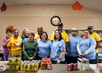 DLA Distribution commander Army Brig. Gen. Richard Dix (back row, third from left) stands with other volunteers at the West Shore Senior Center during the 2015 Federal Day of Service on Oct. 16.