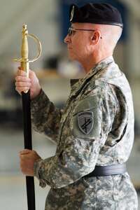 Army Reserve Brig. Gen. William Barriage, the commanding general of the 351st Civil Affairs Command, holds a sword during the Change of Responsibility Ceremony held at Moffett Field, Calif., Oct. 17. Command Sgt. Maj. Gregory Thomsen took the helm as the senior enlisted Soldier from Command Sgt. Maj. Mark Martello. The 351st CACOM has more than 2,100 Soldiers in eight states, to include Hawaii. The 351st CACOM is assigned to the U.S. Army Civil Affairs and Psychological Operations Command (Airborne) based at Fort Bragg, N.C. USACAPOC (A) has more than 13,000 Soldiers with Civil Affairs, Psychological Operations and Information Operations units across the country. USACAPOC(A) has 94 percent of the Army’s General Purpose Forces’ CA Capability, 100 percent of the Army’s General Purpose Forces’ PSYOP Capability and 42 percent of the Army’s General Purpose Forces’ I/O Capability. The command also has oversight of all Army Reserve airborne operations.