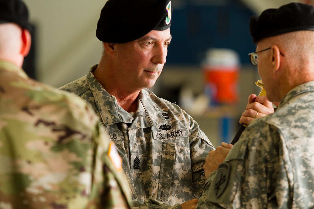 Army Reserve Brig. Gen. William Barriage (right), the commanding general of the 351st Civil Affairs Command, receives the sword from Command Sgt. Maj. Mark Martello during the Change of Responsibility Ceremony held at Moffett Field, Calif., Oct. 17. Command Sgt. Maj. Gregory Thomsen took the helm as the senior enlisted Soldier from Martello. The 351st CACOM has more than 2,100 Soldiers in eight states, to include Hawaii. The 351st CACOM is assigned to the U.S. Army Civil Affairs and Psychological Operations Command (Airborne) based at Fort Bragg, N.C. USACAPOC (A) has more than 13,000 Soldiers with Civil Affairs, Psychological Operations and Information Operations units across the country. USACAPOC(A) has 94 percent of the Army’s General Purpose Forces’ CA Capability, 100 percent of the Army’s General Purpose Forces’ PSYOP Capability and 42 percent of the Army’s General Purpose Forces’ I/O Capability. The command also has oversight of all Army Reserve airborne operations.