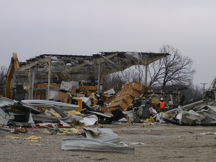 Extensive damage documented by the 88th Regional Support Command of Equipment Concentration Site – 66 at Fort Leonard Wood, Mo., after being struck by a tornado on Dec. 31, 2010. Continuity of Operation Plans allow the 88th RSC to maintain mission essential functions in this type of emergency. In order to be prepared for future emergencies, the 88th RSC’s Crisis Action Team members conducted a Continuity of Operations Plan Exercise on Fort McCoy, Wis., Oct.14. Charles Hudson, 88th Regional Support Command chief of staff said he knows firsthand how important it is to have a COOP in place in the event of a natural disaster.

“The COOP’s priority of effort is to ensure mission essential functions are met,” Hudson said, “and then to ensure minimum degradation of customer support to commands within the 88th RSC geographic area of responsibility.”


“The ability to implement the COOP was instrumental to recovery operations at Equipment Concentration Site – 66 at Fort Leonard Wood when it was struck by a tornado on December 31st, 2010,” Hudson explained.

“Fortunately this was a Federal Holiday or we would have experienced loss of life.  As it was, we lost $2.7M in equipment destroyed, $3.4M in equipment damage, and $5.5M in facilities repair and replacement,” Hudson continued.

“We accounted for 100% of ECS personnel that day, none were impacted personally, and most were called in to work over the weekend to secure equipment and facilities, account for property and begin the slow recovery process,” Hudson said.

“It took nearly a year for ECS-66 to recover from this event and much of that time was spent operating in temporary facilities elsewhere on Fort Leonard Wood. In addition, warehouse operations had to move 140 miles to an available warehouse at Weldon Springs Local Training Area in Saint Charles, Mo., Hudson said.

“Given this real-world scenario,” Hudson said, “a COOP for the 88th RSC Headquarters is very important.”