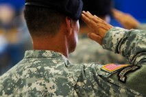 An Army Reserve Soldier assigned to the 351st Civil Affairs Command, salutes during the national anthem during the Change of Responsibility Ceremony held at Moffett Field, Calif., Oct. 17. Command Sgt. Maj. Gregory Thomsen took the helm as the senior enlisted Soldier from Command Sgt. Maj. Mark Martello. The 351st CACOM has more than 2,100 Soldiers in eight states, to include Hawaii. The 351st CACOM is assigned to the U.S. Army Civil Affairs and Psychological Operations Command (Airborne) based at Fort Bragg, N.C. USACAPOC (A) has more than 13,000 Soldiers with Civil Affairs, Psychological Operations and Information Operations units across the country. USACAPOC(A) has 94 percent of the Army’s General Purpose Forces’ CA Capability, 100 percent of the Army’s General Purpose Forces’ PSYOP Capability and 42 percent of the Army’s General Purpose Forces’ I/O Capability. The command also has oversight of all Army Reserve airborne operations.