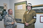 Chief Master Sgt. Scott Berge (left), 33rd Fighter Wing command chief master sergeant, speaks with Airman 1st Class Lucas Hurt, 502nd Security Forces Squadron entry controller, Oct. 14 at the Fort Sam Houston Museum.