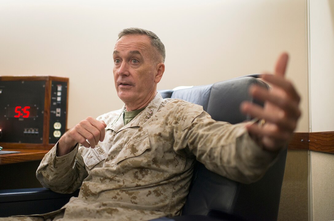 U.S. Marine Corps Gen. Joseph F. Dunford Jr., chairman of the Joint Chiefs of Staff, gives an interview to members of the press while on a C-17 flying from Baghdad, Iraq, Oct. 20, 2015. DoD photo by D. Myles Cullen