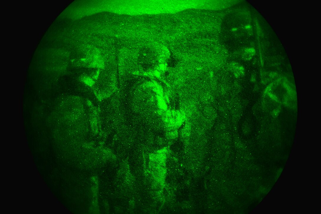 As seen through a night-vision device, U.S. paratroopers prepare for a night live-fire exercise as part of Exercise Rock Proof V at Pocek Range in Postonja, Slovenia, Oct.19, 2015. U.S. Army photo by Davide Dalla Massara