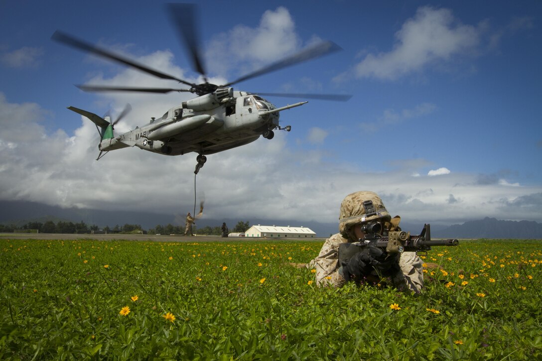 A U.S. Marine provides security for a Marine air-ground task force demonstration during the Kaneohe Bay Air Show on Marine Corps Base Hawaii, Oct. 18, 2015. U.S. Marine Corps photo by Cpl. Aaron S. Patterson