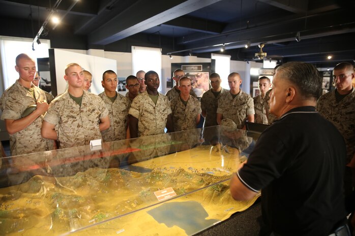 Recruits of Bravo Company, 1st Recruit Training Battalion, listen to a museum docent share his knowledge of World War II during their museum visit at Marine Corps Recruit Depot San Diego, Oct. 7. The museum is divided into sections including the Korean War, Waterhouse Room, Vietnam Gallery, World War II, Medals and Decorations and Modern Warfare. Today, all males recruited from west of the Mississippi are trained at MCRD San Diego. The depot is responsible for training more than 16,000 recruits annually. Bravo Company is scheduled to graduate from recruit training on Oct. 23.