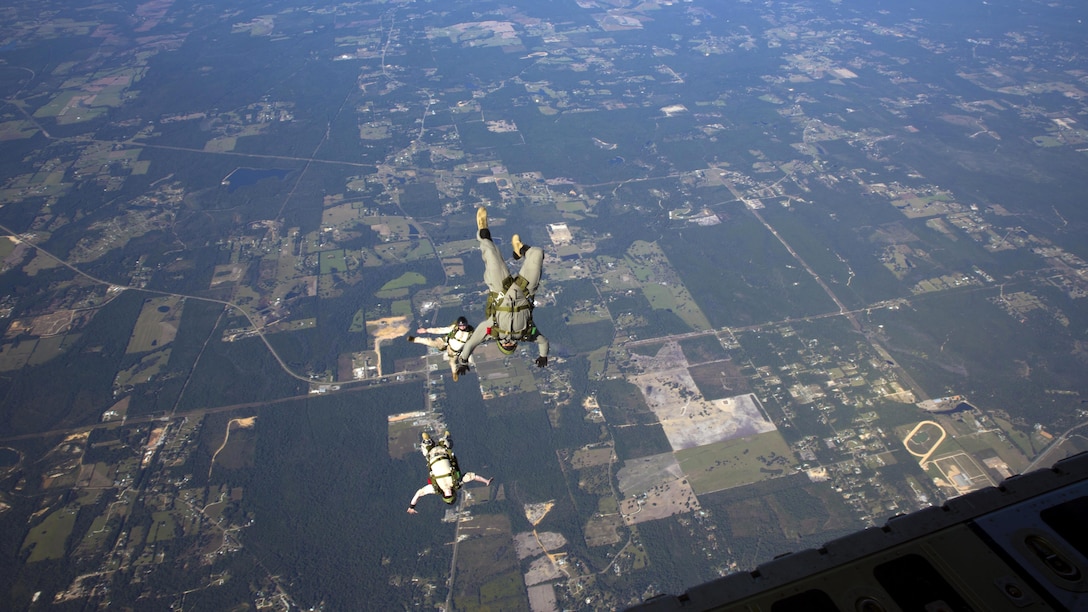 Marines with 3rd Force Reconnaissance Company, 4th Marine Division, Marine Forces Reserve, jump out of a C-130 Hercules aircraft during high altitude – high opening parachute insertion training at Stennis International Airport, MS, Oct. 15, 2015. The goal of the training was to sharpen a skill set that is of great advantage to expeditionary forces, allowing the jumpers to infiltrate locations where access would be too difficult for vehicles.