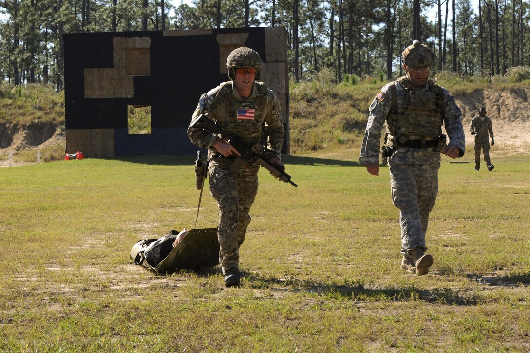 A Green Beret soldier drags a litter bearing a mannequin weighing more than 200 pounds during a stress shoot competition on Eglin Air Force Base, Fla., Oct. 15, 2015. He is assigned to the 7th Special Forces Group. The competition tests the Special Forces soldier's ability to navigate terrain and obstacles while engaging targets accurately despite an elevated heart rate and rapid breathing. U.S. Army photo by Staff Sgt. William Waller